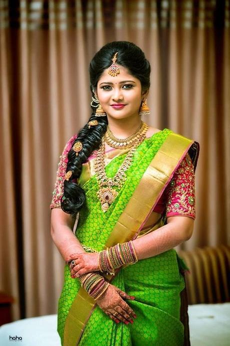 In a gorgeous black color pattu / kanjeevaram saree with butti, red color  elbow length sleeve b… | Saree wearing styles, Indian saree blouses designs,  Saree designs