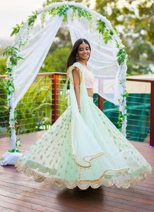 Velvet green bridal lehenga with shawl and peach net dupatta – Ricco India